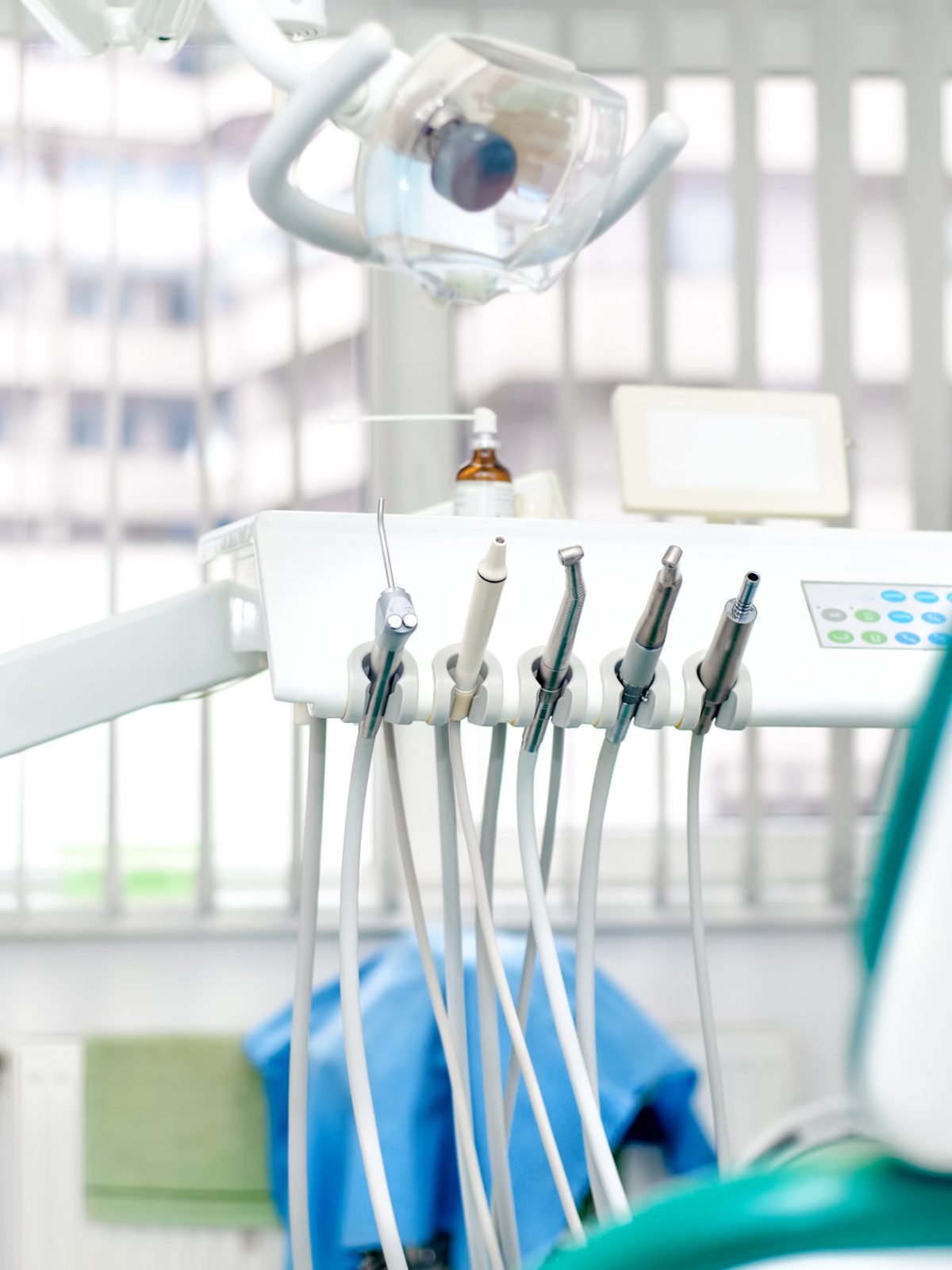 Modern dental clinic with tools, patient chair and equipment